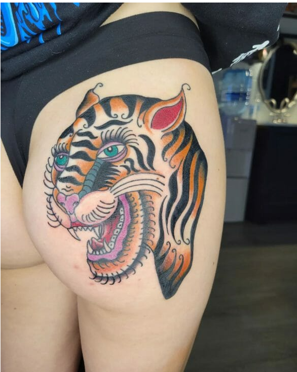 ass tattoo with a colorful tiger