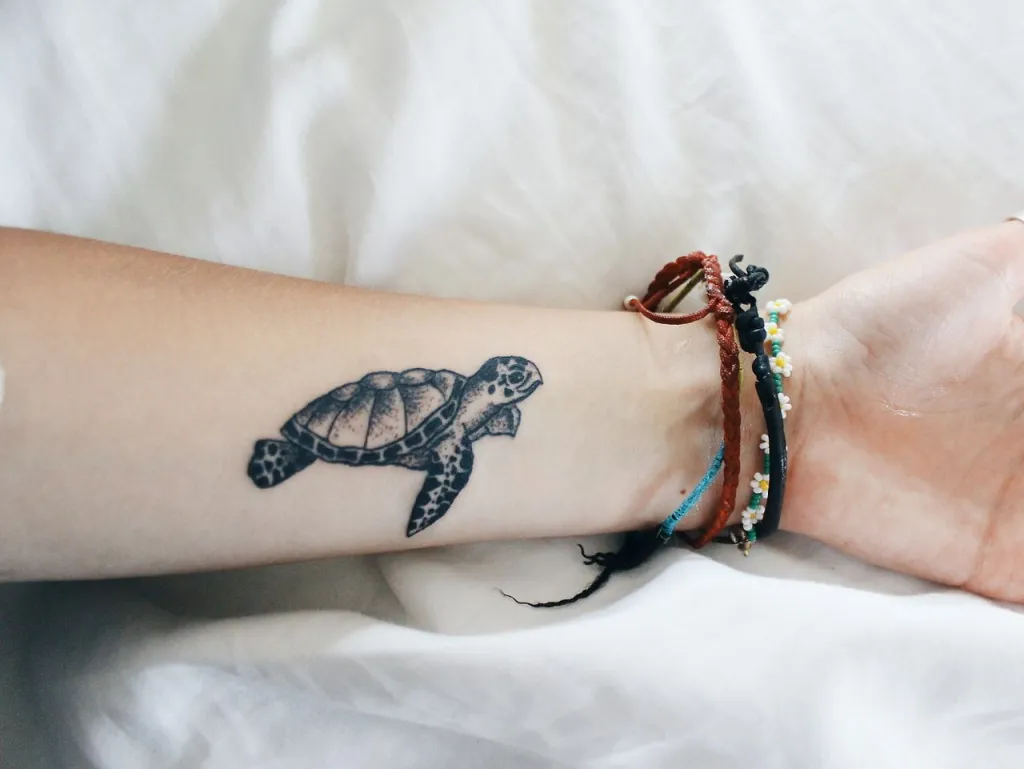 Small sea turtle tattoo